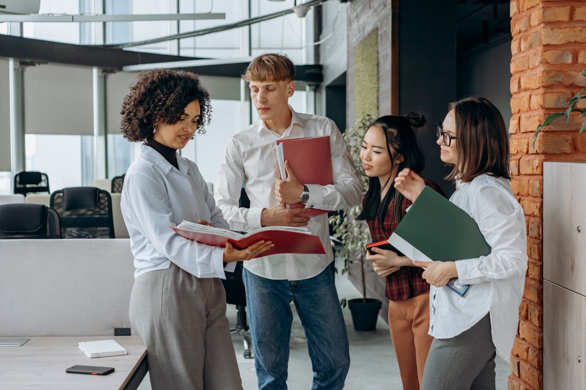 Business colleagues reviewing documents together in an office